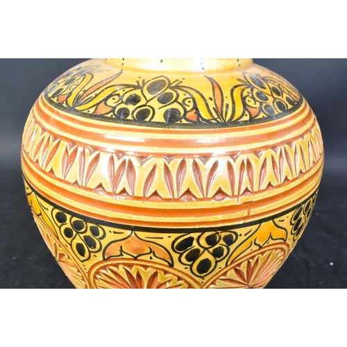 12 - A vintage 20th century Moroccan 'Safi' ceramic pottery vase in orange & yellow colourways with textu... 