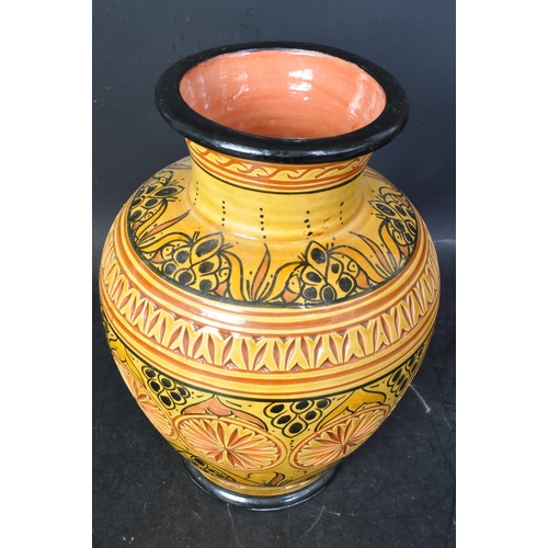 12 - A vintage 20th century Moroccan 'Safi' ceramic pottery vase in orange & yellow colourways with textu... 