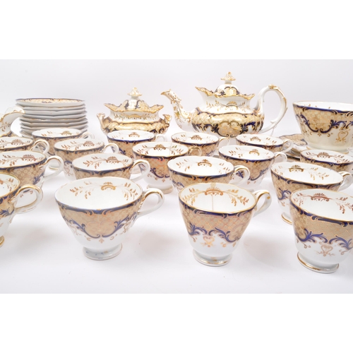 128 - A vintage 20th Century Coalport rococo style tea service cobalt blue & gilt. Comprising of; teapot, ... 