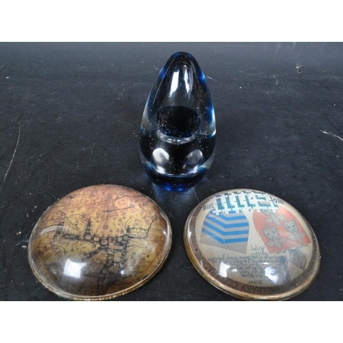 14 - A collection of retro vintage 20th Century glass paperweights. Including scenic and tourist place pa... 