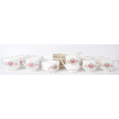 145 - A vintage 20th century bone china Royal Standard tea service in the Rambling Rose pattern. The servi... 