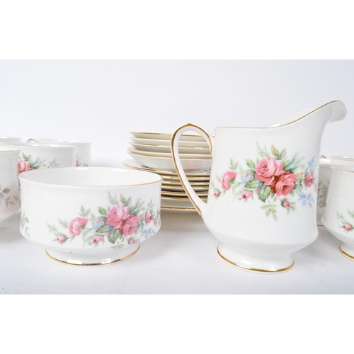 145 - A vintage 20th century bone china Royal Standard tea service in the Rambling Rose pattern. The servi... 