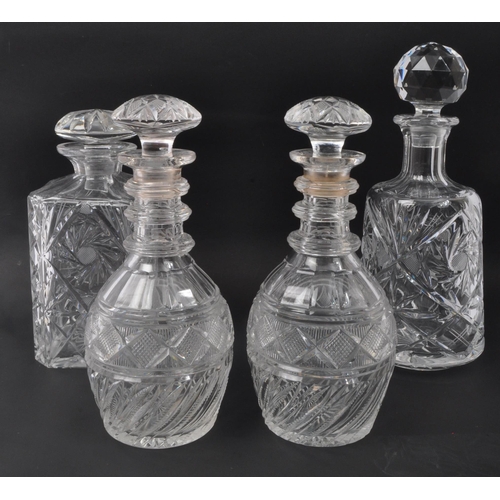 175 - A collection of vintage 20th Century glass alcohol decanter / jugs / receptacles. Four together with... 