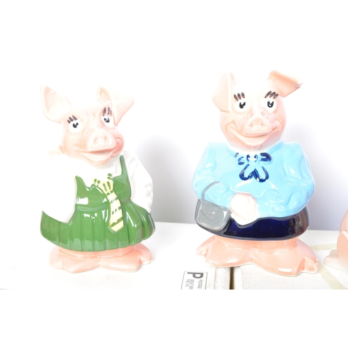 182 - A set of five original Wade made Natwest pigs. Four of the ceramic money boxes within the original p... 