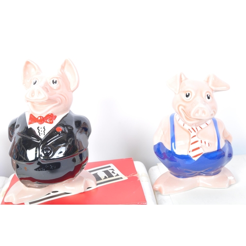 182 - A set of five original Wade made Natwest pigs. Four of the ceramic money boxes within the original p... 