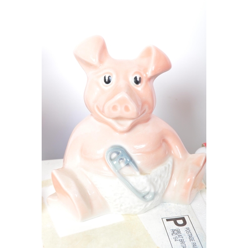 182 - A set of five original Wade made Natwest pigs. Four of the ceramic money boxes within the original p... 