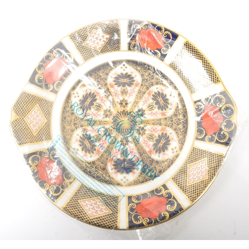 19 - A contemporary 2002 Royal Crown Derby china dessert / cake plate with side handles in the Old Imari ... 