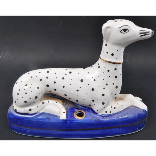 190 - A pair of 19th century Victorian Staffordshire Dalmatians dog figures sitting upon cobalt plinth bas... 