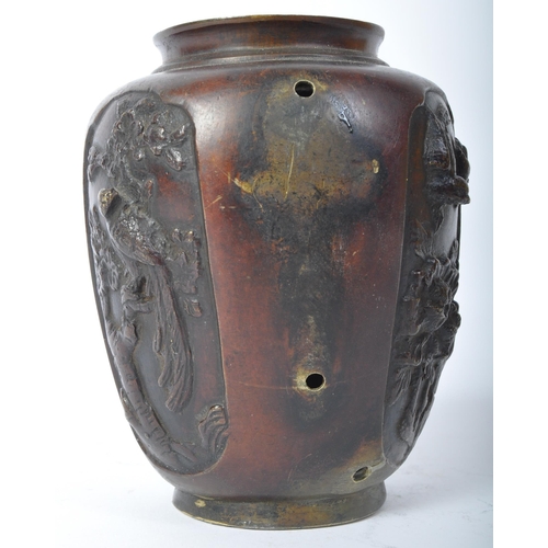 201 - A 20th Century Japanese bronze vase. AF. Having a lipped top with tapering body with four panels dep... 