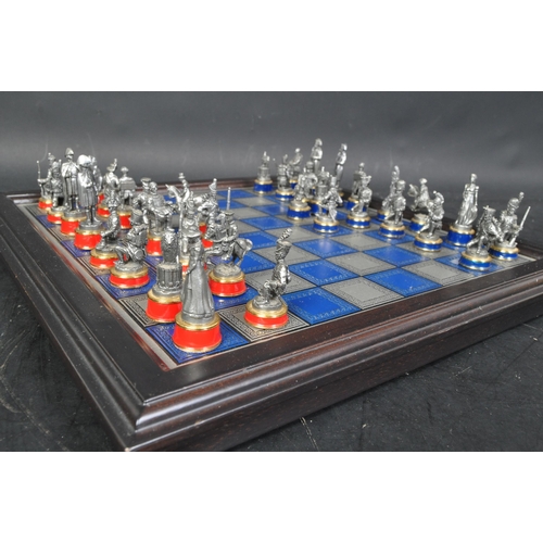 209 - A 20th century The Waterloo Museum 'The Waterloo Battle Chess Set' with chess board. The set having ... 