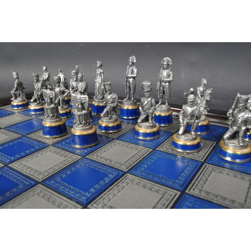 209 - A 20th century The Waterloo Museum 'The Waterloo Battle Chess Set' with chess board. The set having ... 