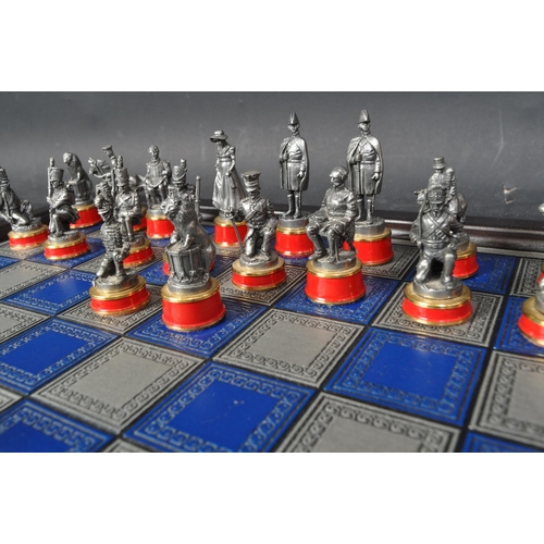 209 - A 20th century The Waterloo Museum 'The Waterloo Battle Chess Set' with chess board. The set having ... 