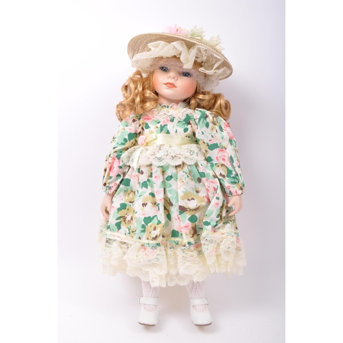 218 - A collection of vintage 20th century porcelain dolls. Victorian Impex Corp, The Classique Collection... 