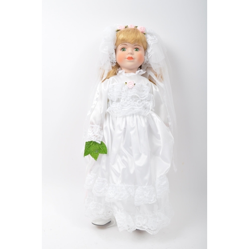 218 - A collection of vintage 20th century porcelain dolls. Victorian Impex Corp, The Classique Collection... 