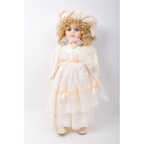 218 - A collection of vintage 20th century porcelain dolls. Victorian Impex Corp, The Classique Collection... 