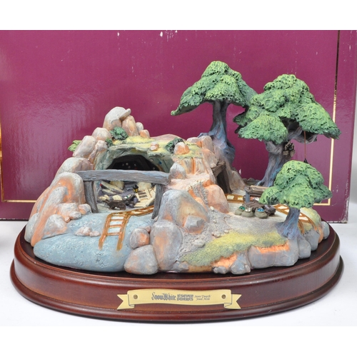 219 - A collection of vintage 20th century boxed figurines and ornaments to include a Walt Disney Enchante... 