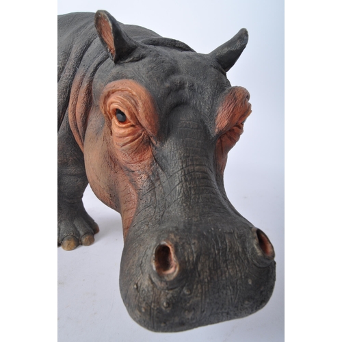 227 - A 20th century resin hippopotamus sculpture modelled in the form of a hippo with infant by is side. ... 