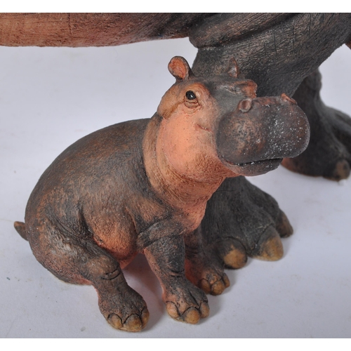 227 - A 20th century resin hippopotamus sculpture modelled in the form of a hippo with infant by is side. ... 