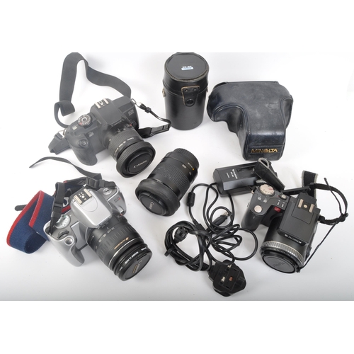 239 - An assortment of retro vintage 20th century photographic equipment. The lot to include a Canon EOS 3... 