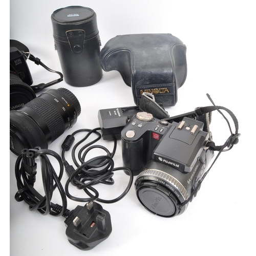 239 - An assortment of retro vintage 20th century photographic equipment. The lot to include a Canon EOS 3... 