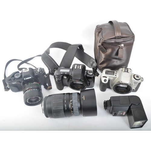 242 - An assortment of four retro vintage 20th century Canon photographic cameras. The lot to include a Ca... 