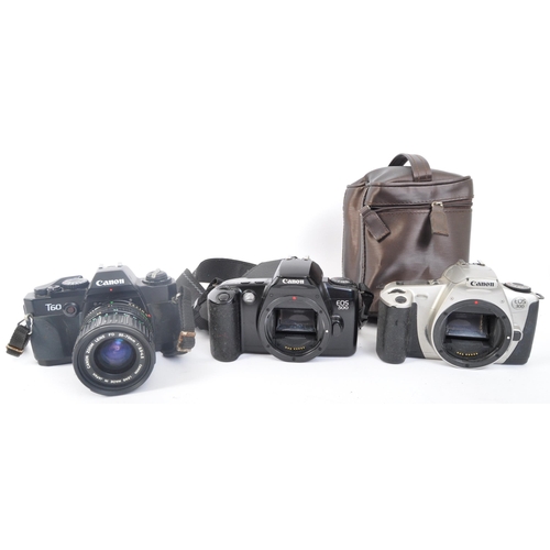 242 - An assortment of four retro vintage 20th century Canon photographic cameras. The lot to include a Ca... 