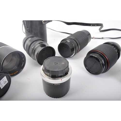 244 - An assortment of retro vintage 20th century photographic equipment lenses. The lot to include a Cano... 