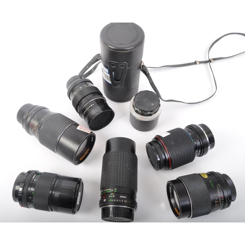 244 - An assortment of retro vintage 20th century photographic equipment lenses. The lot to include a Cano... 