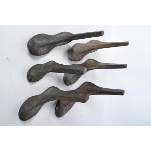 245 - An assortment of early 20th century cast iron shoe makers cobblers lasts. Various sizes and all stam... 