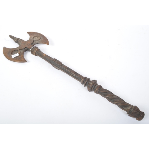 247 - A 20th century cast metal double bit axe decorated with heraldic fleur de lys and palmette motifs. M... 