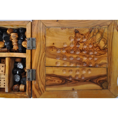 252 - A 20th century burr walnut games compendium. The games box to include draughts, chess, solitaire & d... 