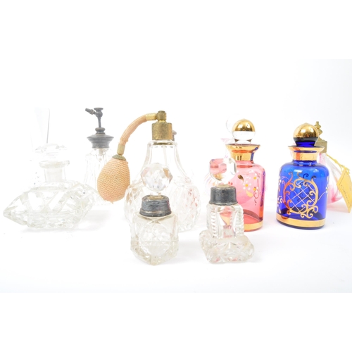 264 - A collection of 19th century Victorian and vintage glass scent bottles and perfume atomizers. The lo... 