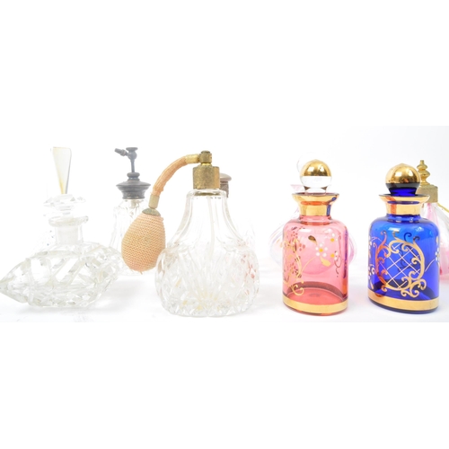 264 - A collection of 19th century Victorian and vintage glass scent bottles and perfume atomizers. The lo... 