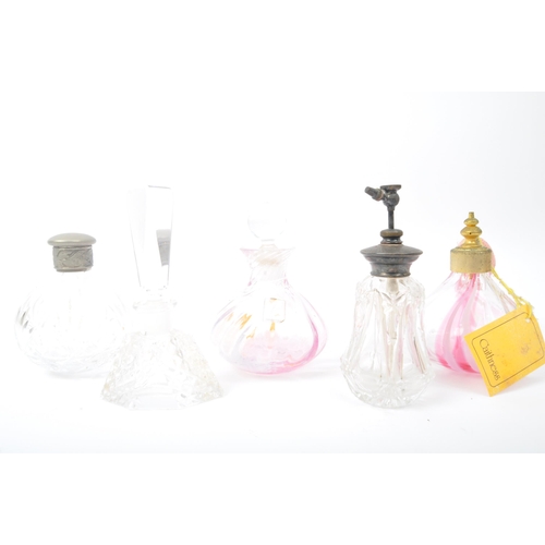 264 - A collection of 19th century Victorian and vintage glass scent bottles and perfume atomizers. The lo... 