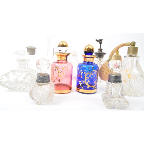 264 - A collection of 19th century Victorian and vintage glass scent bottles and perfume atomizers. The lo... 