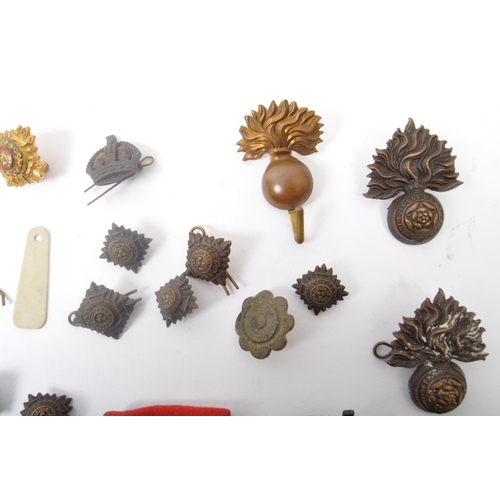 268 - A collection of regimental military metal buttons. To include The Royal Welch Fusiliers alongside Ro... 