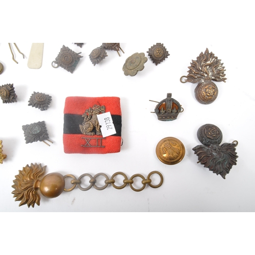 268 - A collection of regimental military metal buttons. To include The Royal Welch Fusiliers alongside Ro... 