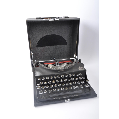 272 - An early 20th century Imperial typewriter. The typewriter having gilt lettering to the black ebonise... 