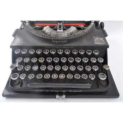 272 - An early 20th century Imperial typewriter. The typewriter having gilt lettering to the black ebonise... 