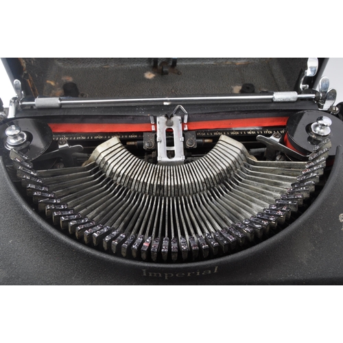 272 - An early 20th century Imperial typewriter. The typewriter having gilt lettering to the black ebonise... 