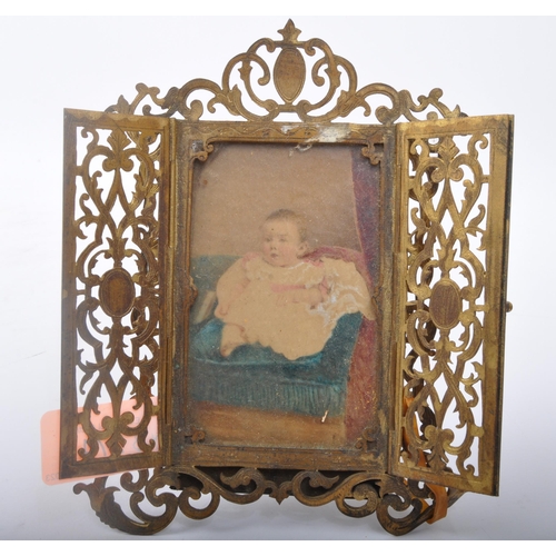 274 - A 19th century gilded metal triptych photo frame having pierced decoration, an early 20th century be... 