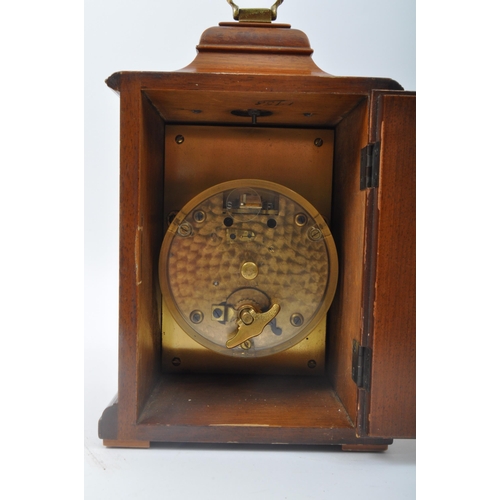 278 - A collection of three vintage retro mid 20th century clocks to include a Swiza eight jewels clock in... 