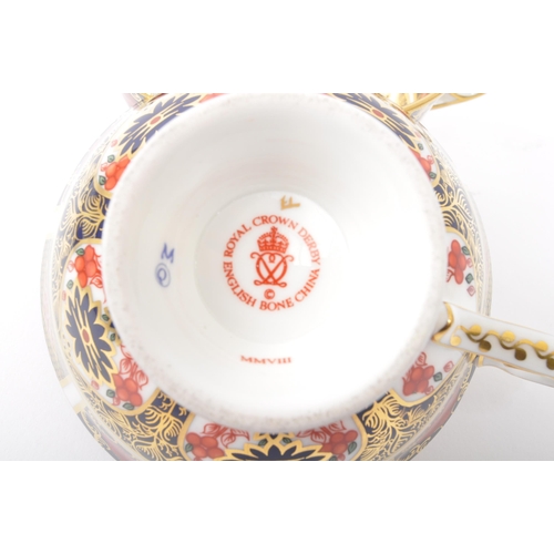 28 - A pair of contemporary 2008 Royal Crown Derby china Elizabeth tea cups in the Old Imari pattern. Bot... 