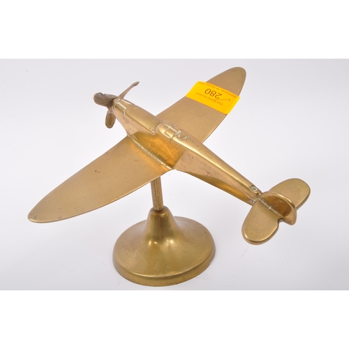 280 - A 20th century WWI World War One style brass spitfire aeroplane figure having articulated propellar ... 