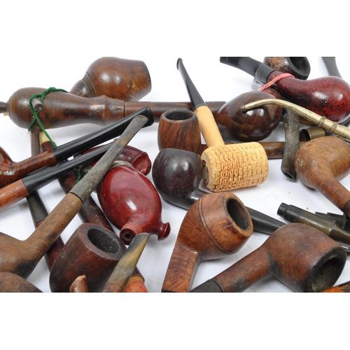 282 - A large extensive collection of 19th century and later smoking tobacco pipes to include carved Black... 