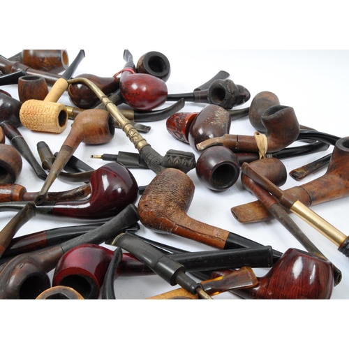 282 - A large extensive collection of 19th century and later smoking tobacco pipes to include carved Black... 