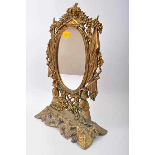 286 - A 20th century gilt metal table top mirror having pierced heraldic decoration to frame with crown, k... 