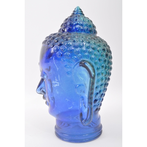 288 - A vintage 20th century blue pressed glass buddha head. Measures 25cm length.