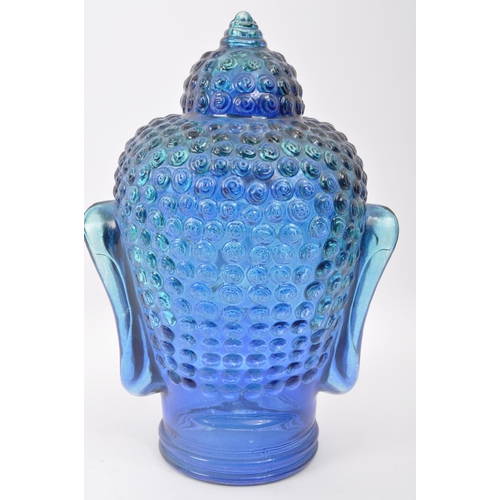 288 - A vintage 20th century blue pressed glass buddha head. Measures 25cm length.