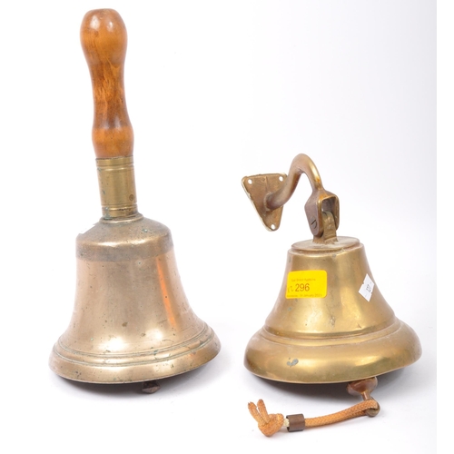 296 - A 19th century Victorian brass hand held bell with turned wood handle together with an early 20th ce... 